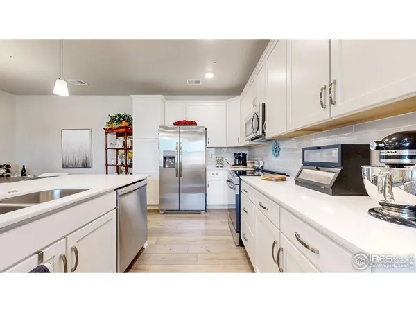 a kitchen with a table and chairs in it