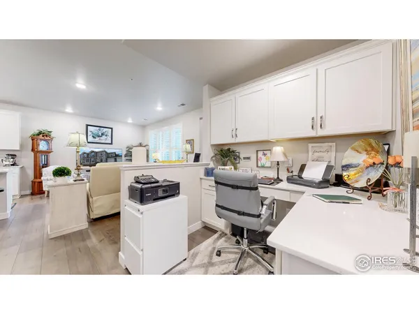 a kitchen with stainless steel appliances a stove a sink a refrigerator and cabinets