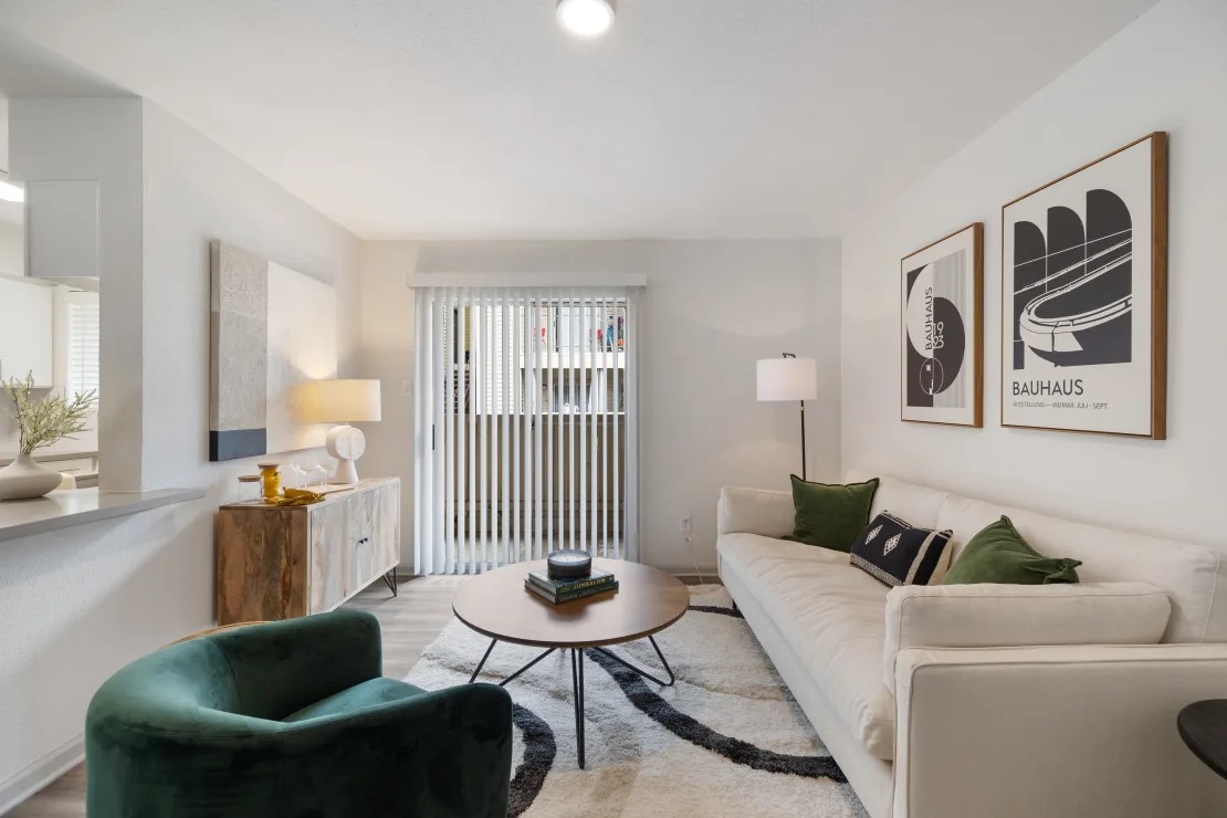 a living room with furniture and a window