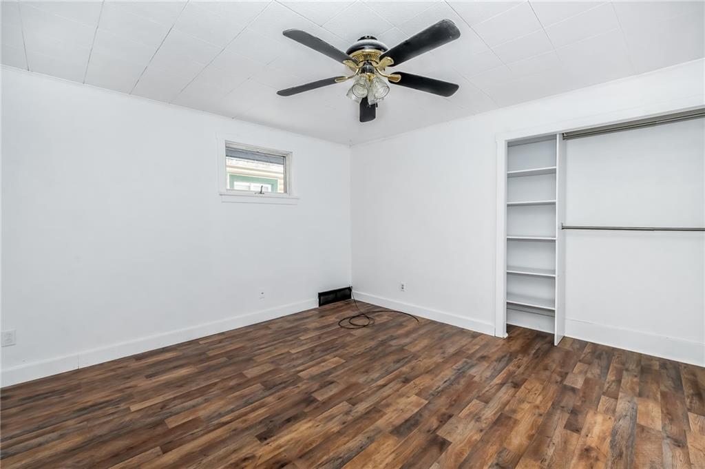 925 Roup Avenue Brackenridge, PA 15014 - Photo 15 of 28 a view of an empty room with a window and wooden floor