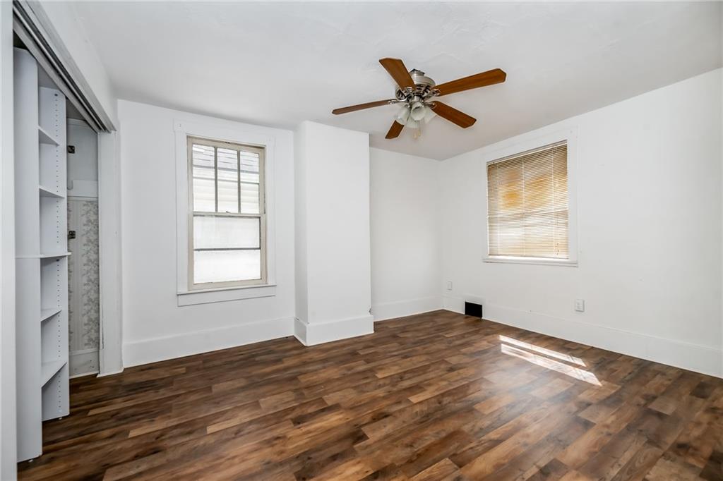 925 Roup Avenue Brackenridge, PA 15014 - Photo 17 of 28 a view of empty room with wooden floor and fan