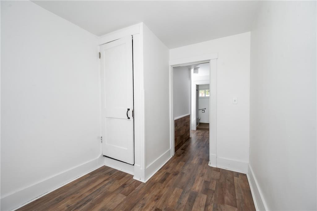 925 Roup Avenue Brackenridge, PA 15014 - Photo 19 of 28 a view of a hallway with wooden floor