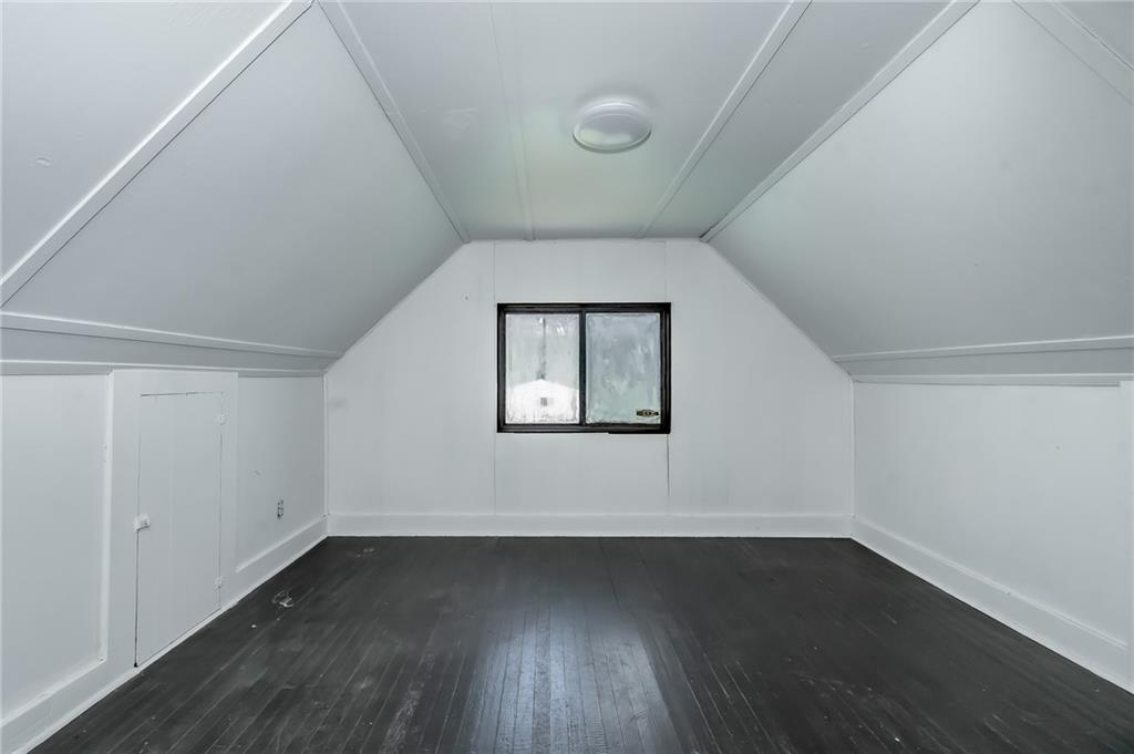 925 Roup Avenue Brackenridge, PA 15014 - Photo 20 of 28 an empty room with wooden floor and windows