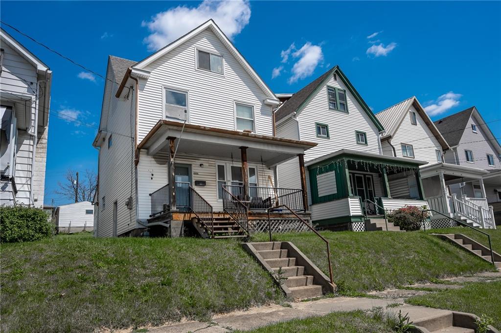 925 Roup Avenue Brackenridge, PA 15014 - Photo 2 of 28 a view of a house with garden