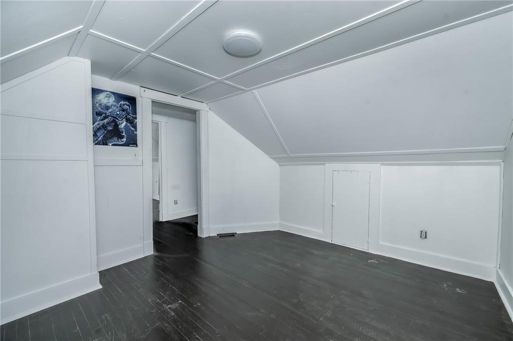 925 Roup Avenue Brackenridge, PA 15014 - Photo 21 of 28 a view of a room with wooden floors and led lights