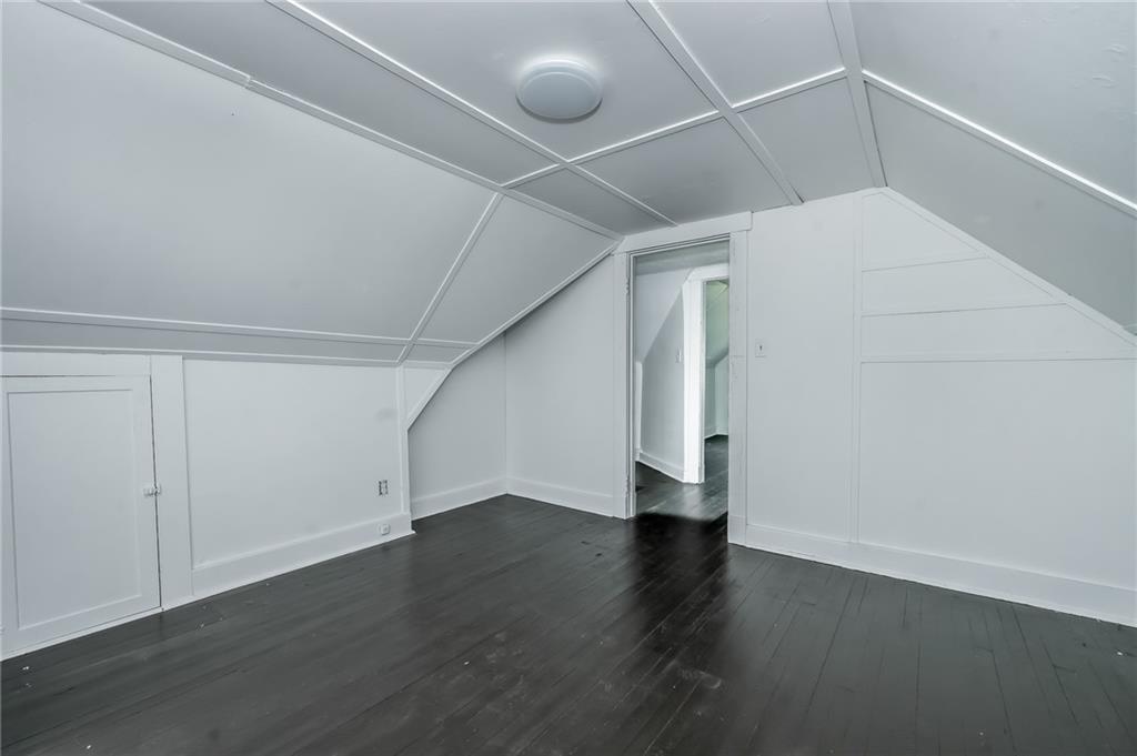 925 Roup Avenue Brackenridge, PA 15014 - Photo 22 of 28 a view of an empty room with wooden floor