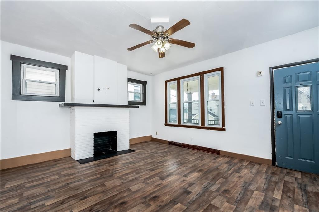 925 Roup Avenue Brackenridge, PA 15014 - Photo 7 of 28 a view of an empty room with window and wooden floor