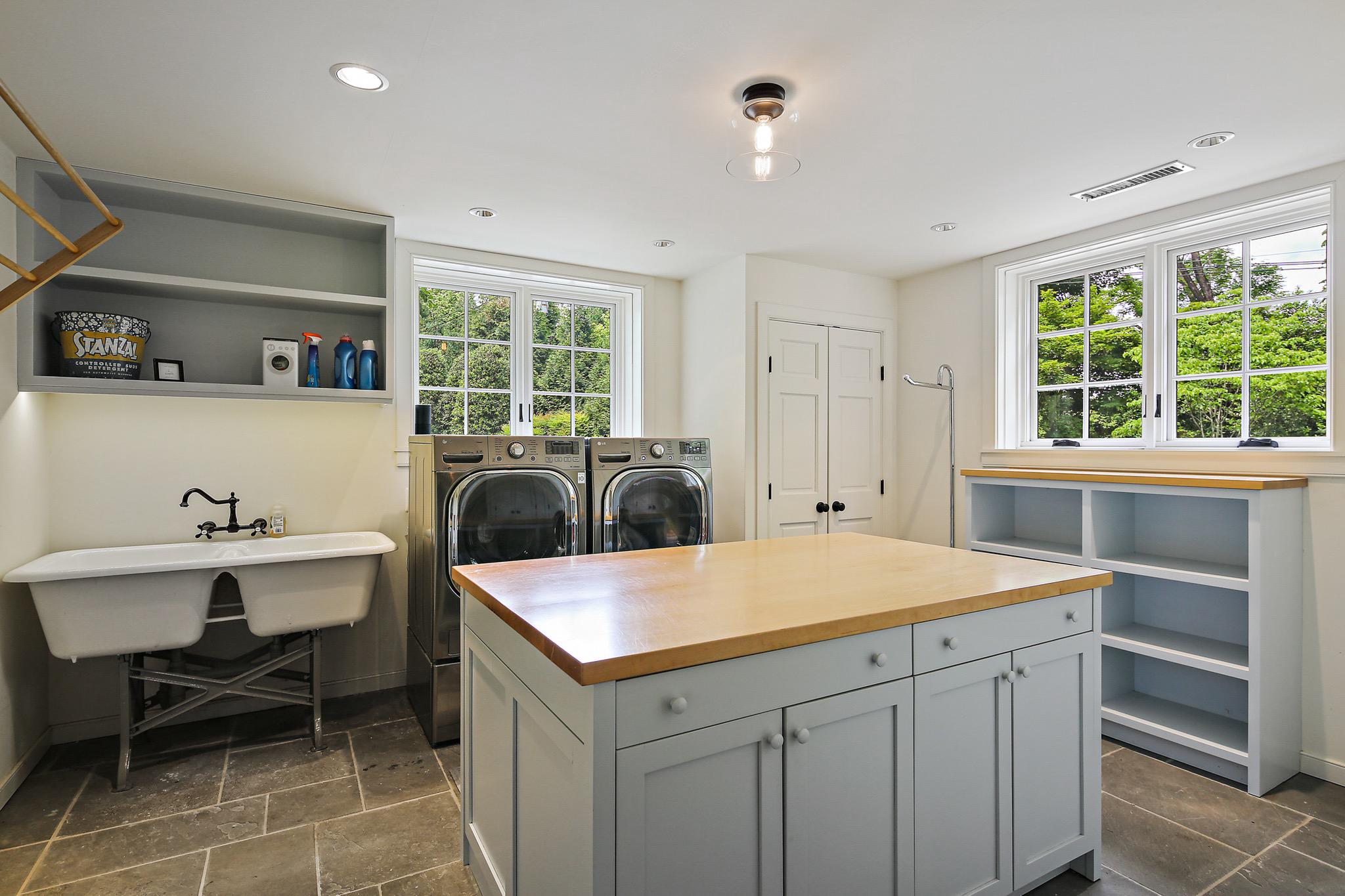 900 Army Road Baltimore, MD 21204 - Photo 46 of 99 + laundry with storage closets, shelving + island.