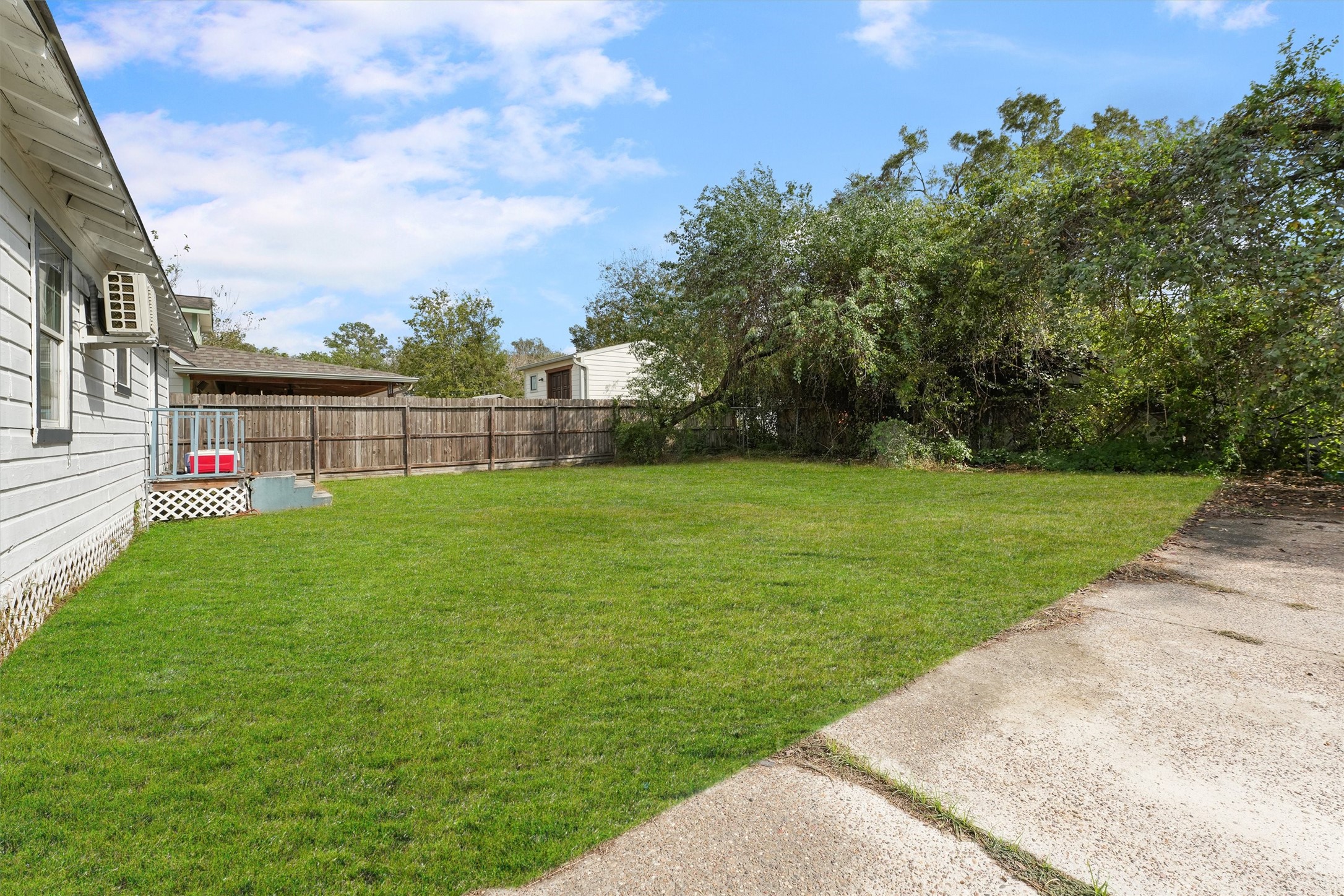 8514 Spaulding Street Houston, TX 77016 - Photo 10 of 19 a view of a garden with a building in the background