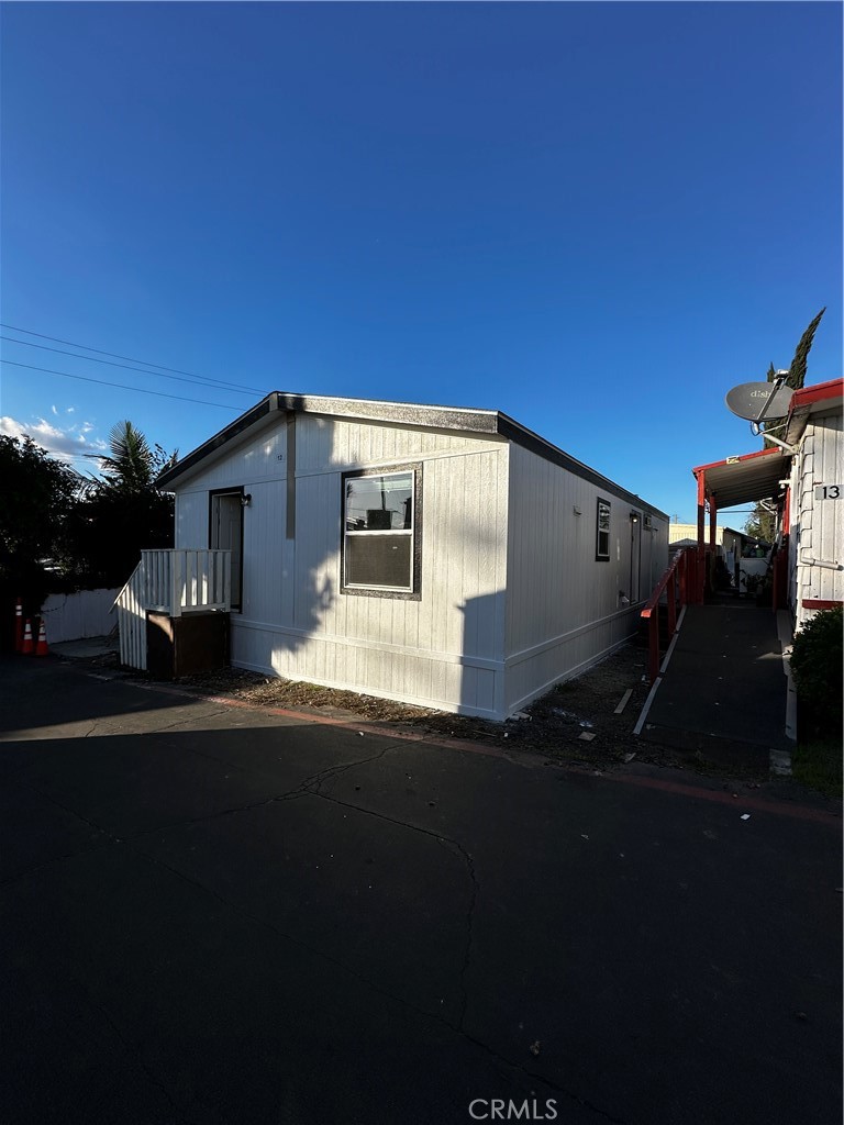 21845 Grand Terrace Road, Unit 12 Grand Terrace, CA 92313 - Photo 2 of 7 a front view of a house with a yard