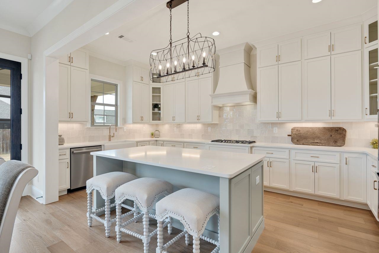 606 Cedar Shadows Circle West Collierville, TN 38017 - Photo 13 of 35 a kitchen with kitchen island granite countertop a sink center island and cabinets