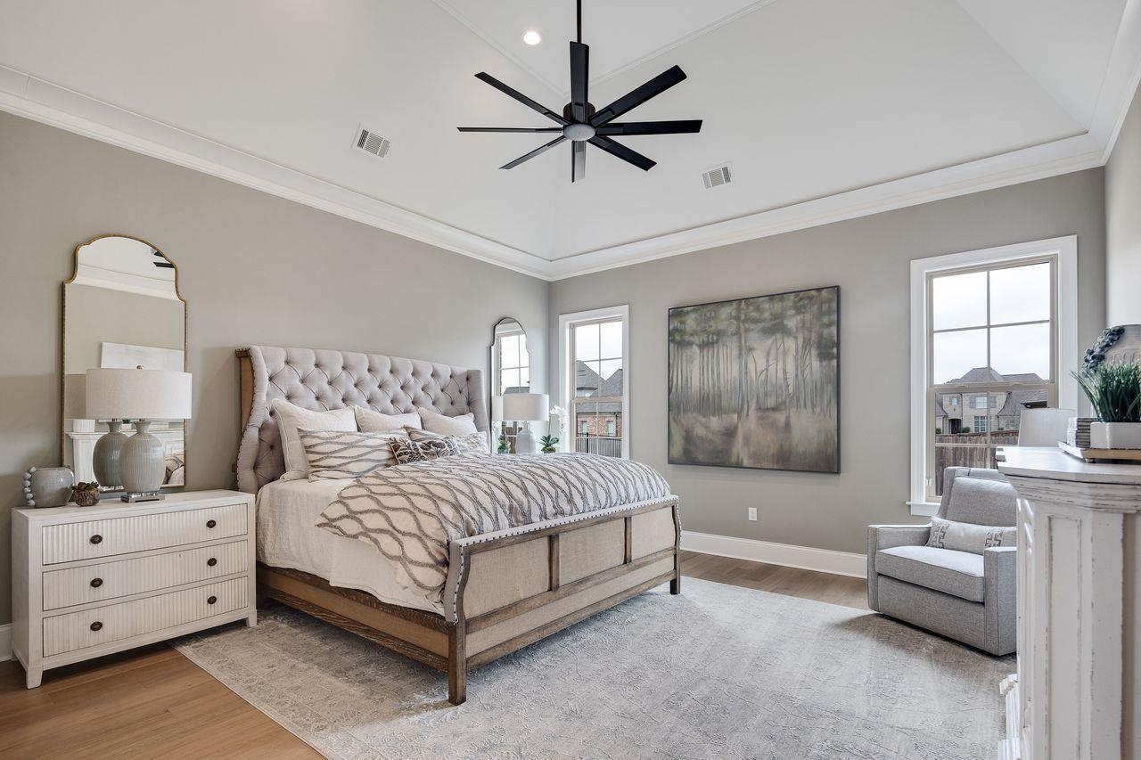 606 Cedar Shadows Circle West Collierville, TN 38017 - Photo 18 of 35 a spacious bedroom with a bed and a couch