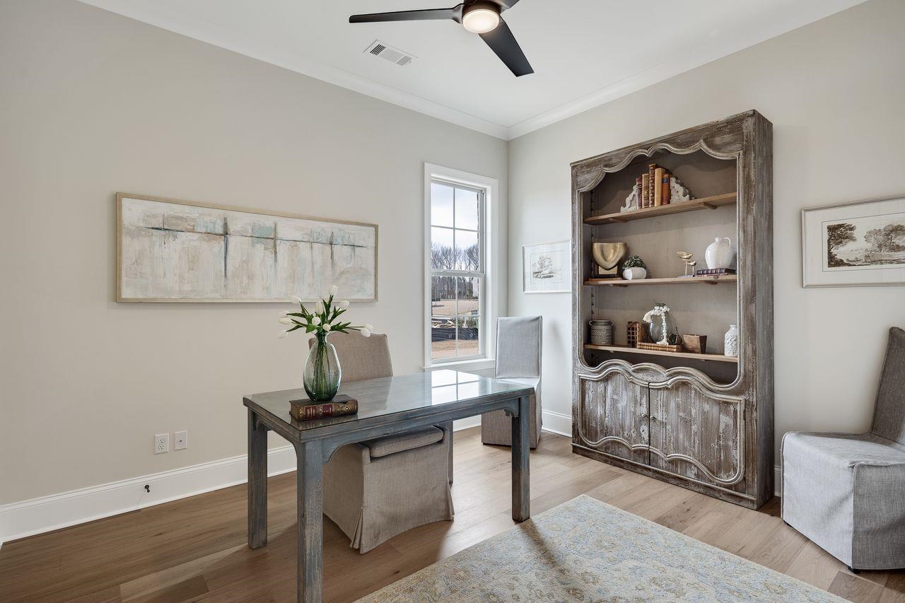 606 Cedar Shadows Circle West Collierville, TN 38017 - Photo 24 of 35 a living room with stainless steel appliances furniture a rug and a window