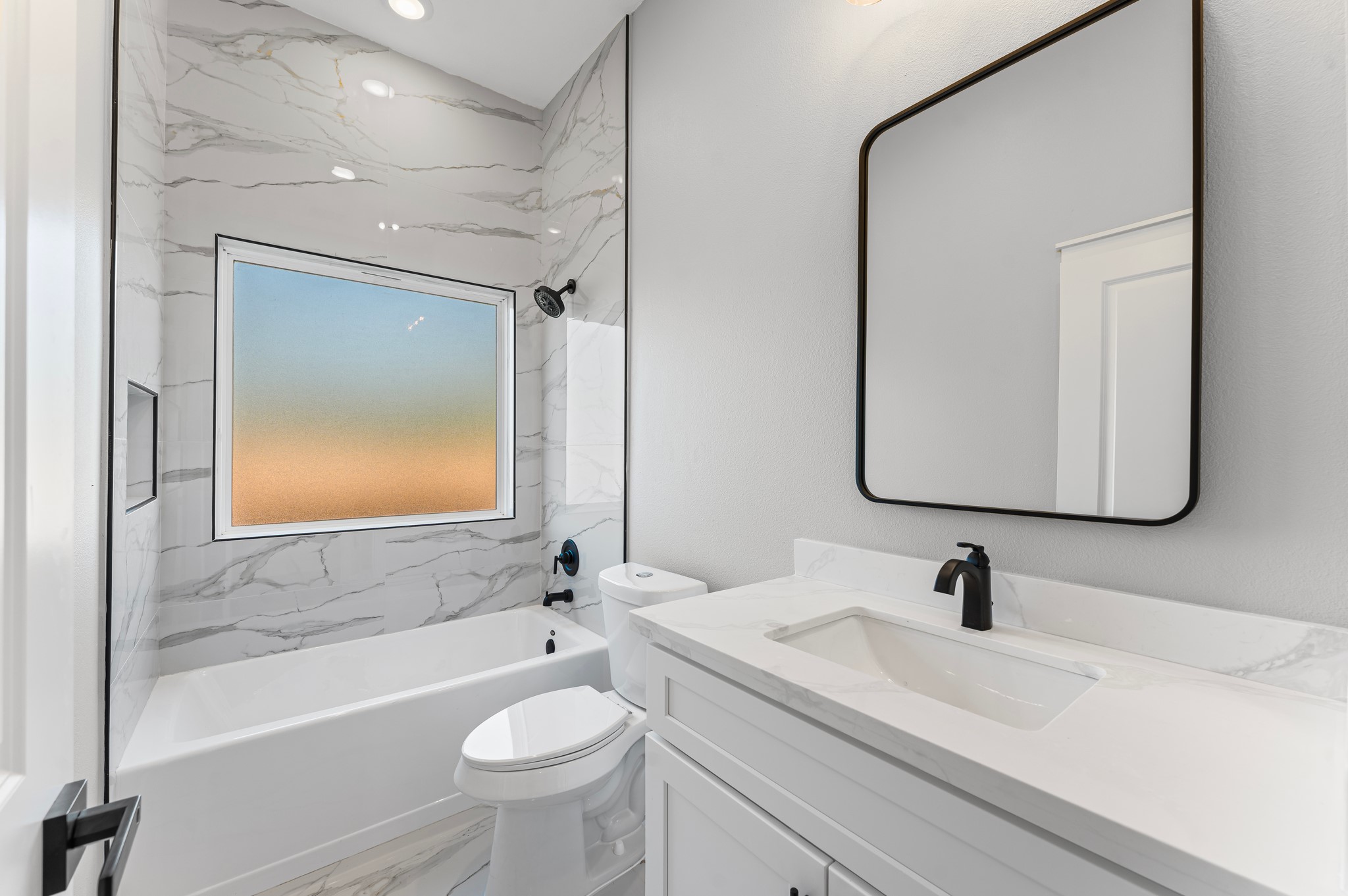 1218 Peter Pine Street Huffman, TX 77336 - Photo 6 of 9 a bathroom with a sink a toilet and a bathtub