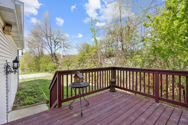 a view of balcony with wooden floor