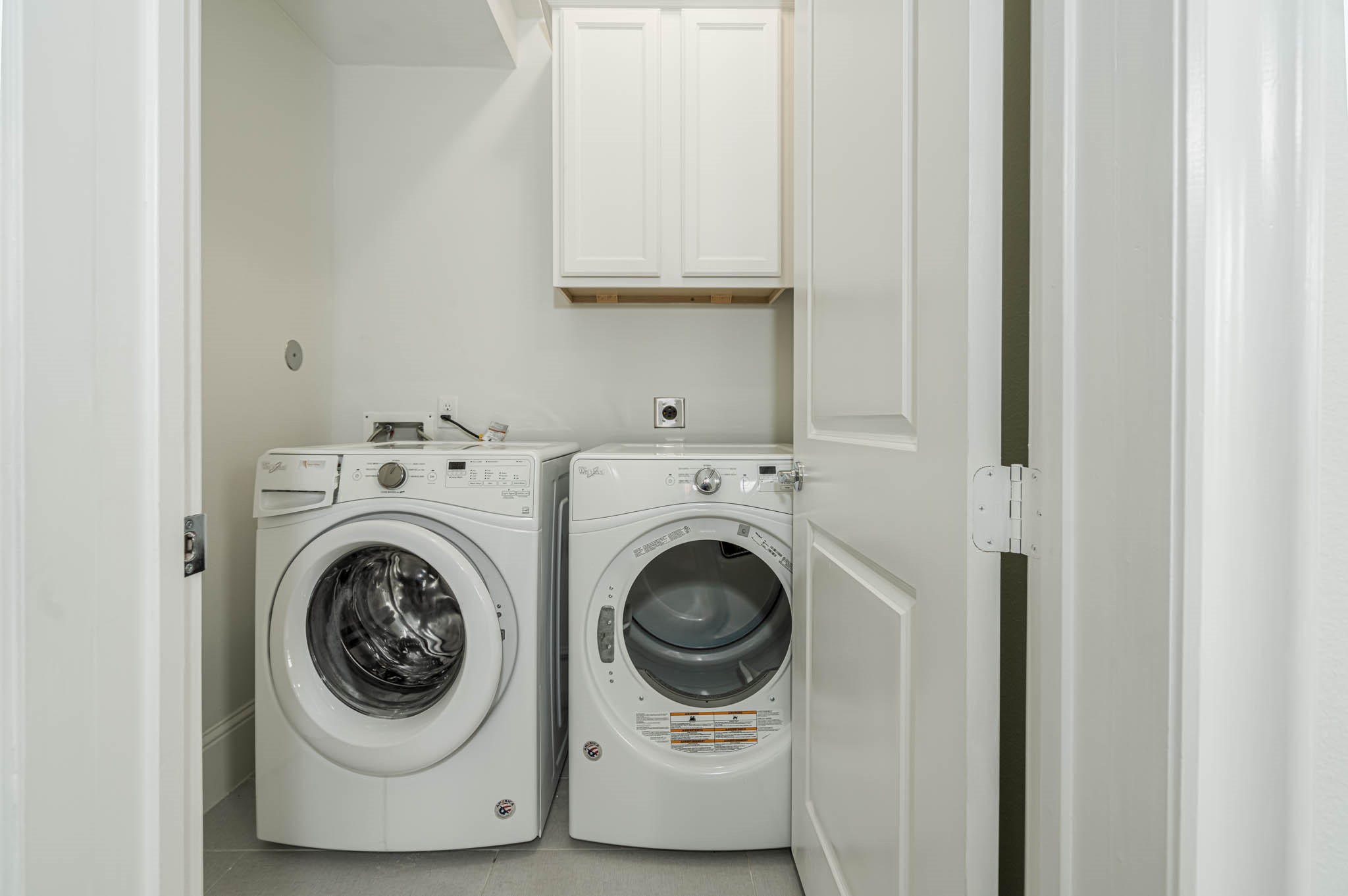 7715 South Fall Run Crossing Houston, TX 77055 - Photo 19 of 22 a utility room with dryer and washer