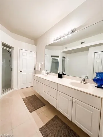 a bedroom with furniture and a chandelier