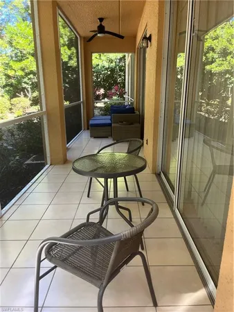 a view of a glass door with a tree in it