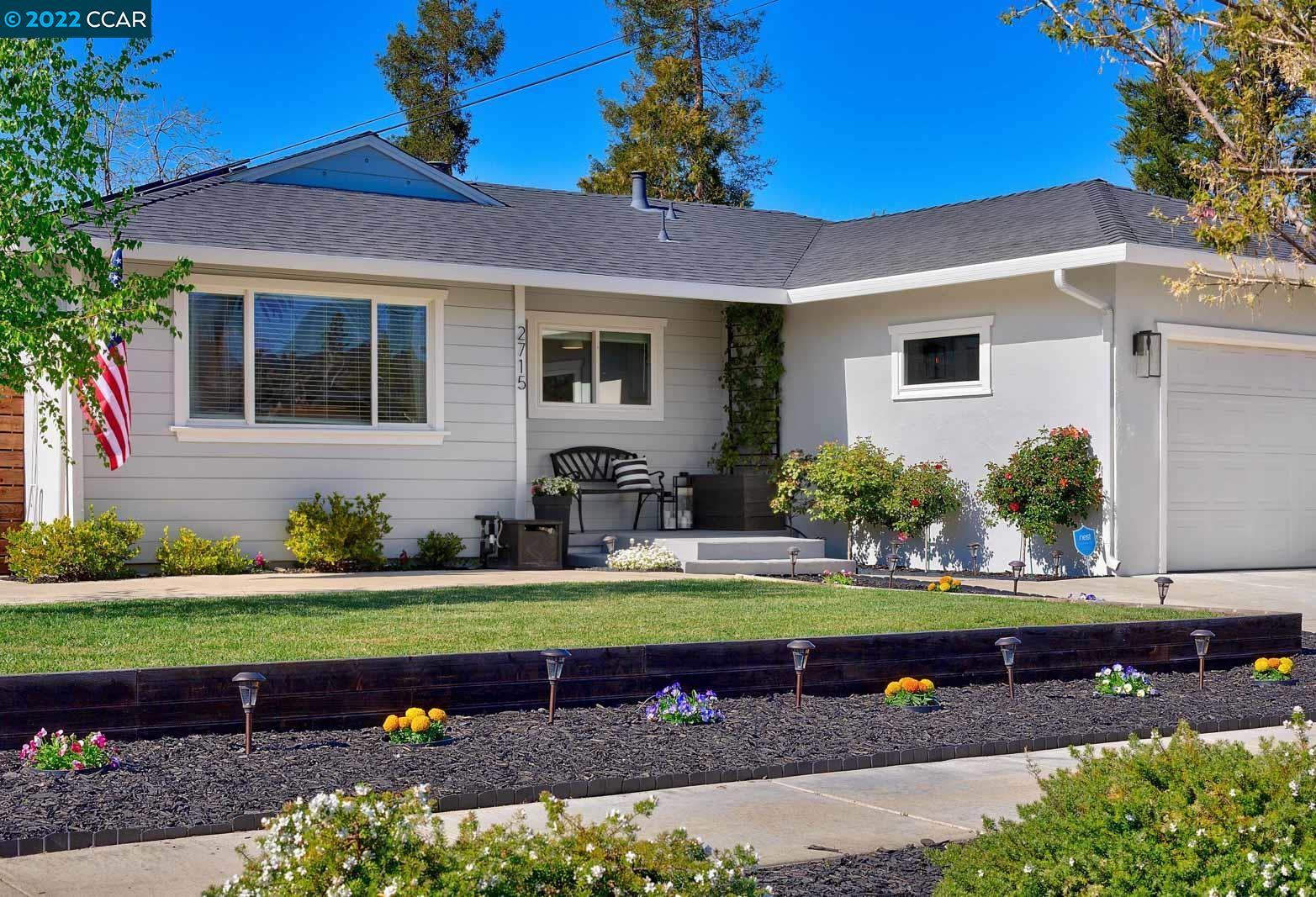 front view of a house with a yard