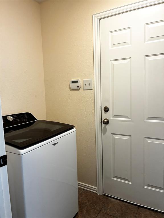 7936 Tournament Road Frisco, TX 75035 - Photo 22 of 28 a utility room with dryer and washer