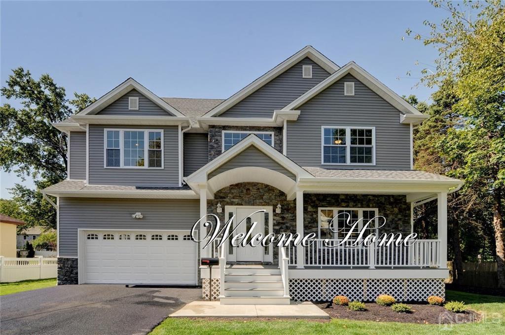 127 North Hill Road Colonia, NJ 07067 - Photo 1 of 40 a front view of a house with a yard