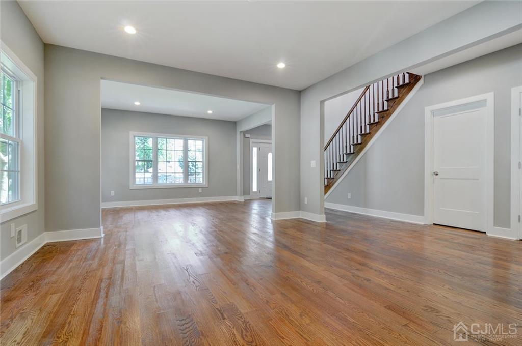 127 North Hill Road Colonia, NJ 07067 - Photo 12 of 40 a view of an empty room with wooden floor and a window