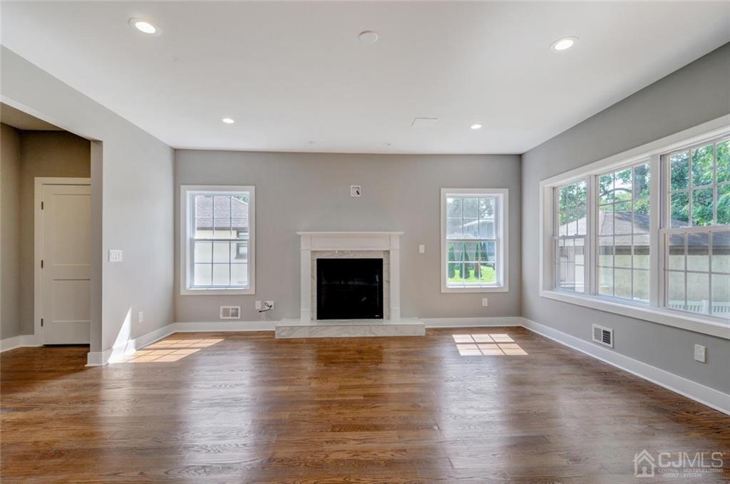 127 North Hill Road Colonia, NJ 07067 - Photo 16 of 40 a view of an empty room with wooden floor and a window