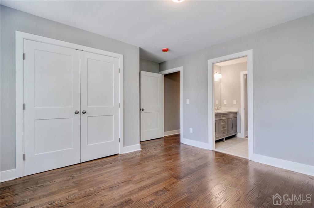 127 North Hill Road Colonia, NJ 07067 - Photo 27 of 40 a view of an empty room with wooden floor