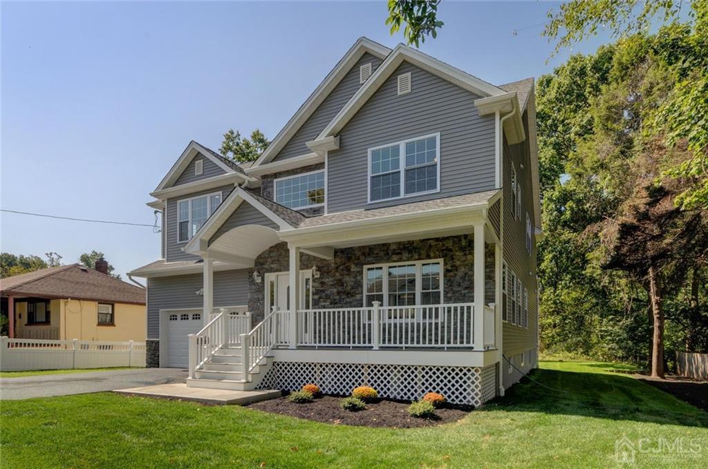 127 North Hill Road Colonia, NJ 07067 - Photo 3 of 40 a front view of a house with a yard