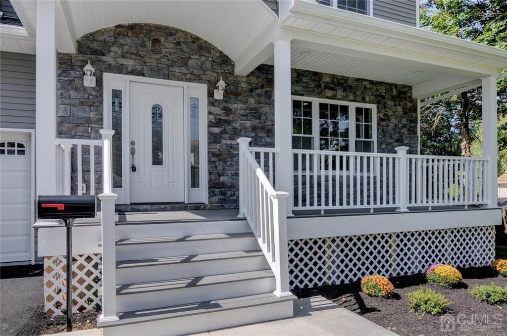 127 North Hill Road Colonia, NJ 07067 - Photo 5 of 40 a view of a brick house with a bench