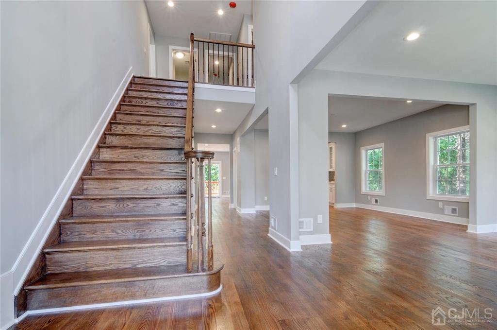 127 North Hill Road Colonia, NJ 07067 - Photo 8 of 40 a view of an entryway with wooden floor and stairs