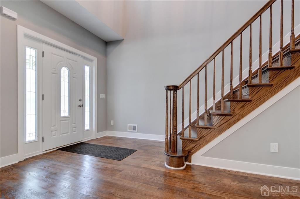 127 North Hill Road Colonia, NJ 07067 - Photo 9 of 40 a view of an entryway with wooden floor and door