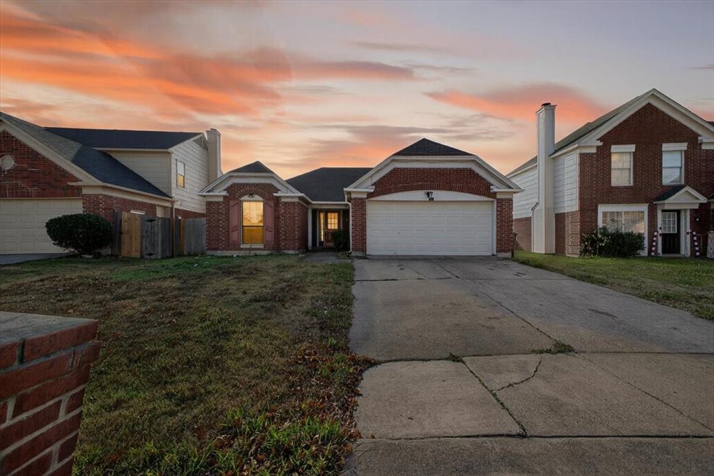920 Danforth Place Arlington, TX 76017 - Photo 1 of 28 a front view of a house with a yard