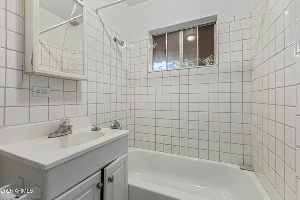 a bathroom with a sink and a bathtub