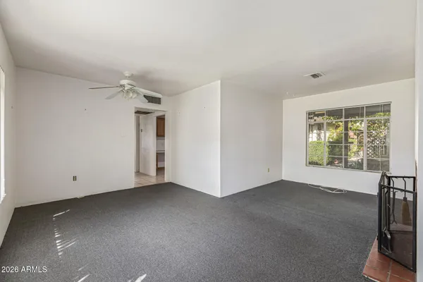 a view of an empty room with a window