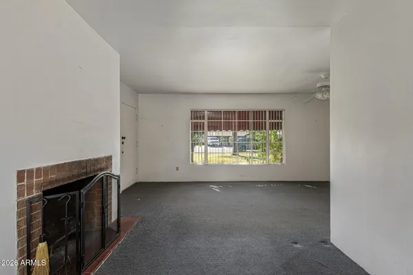a view of empty room with windows