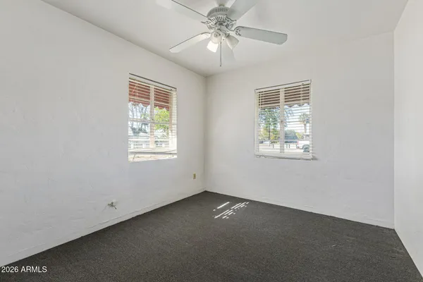 a view of an empty room with a window