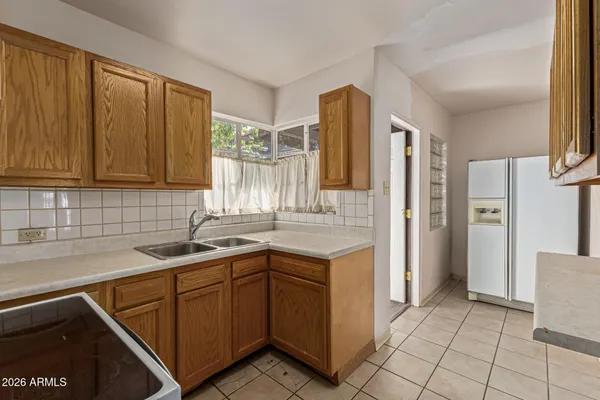 a kitchen with a sink and cabinets