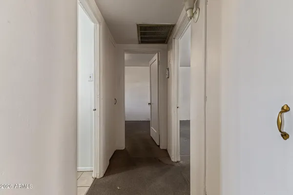 a view of a bathroom from a hallway