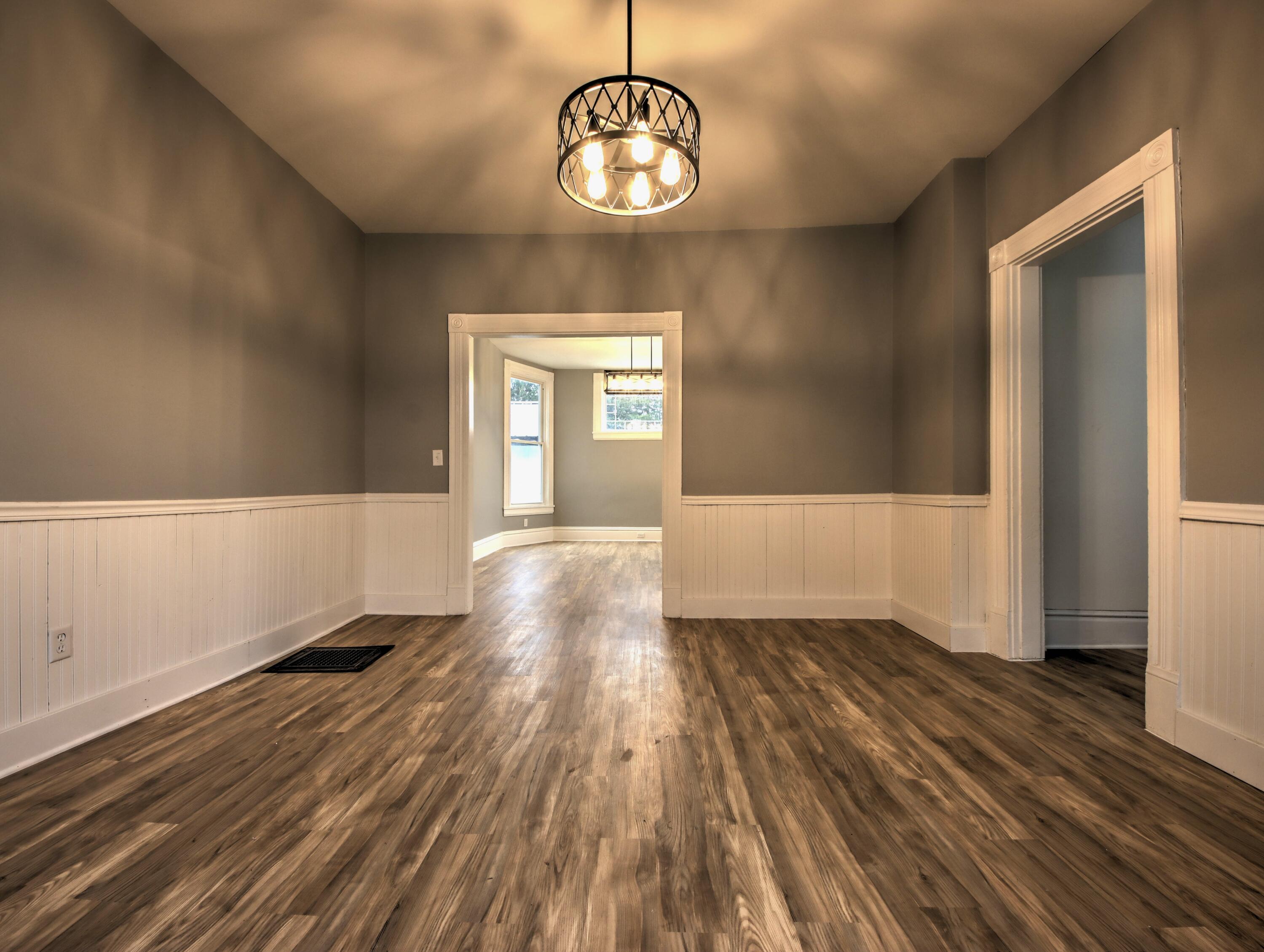 1005 Harrison Street La Porte, IN 46350 - Photo 14 of 54 a view of a room with wooden floor and staircase