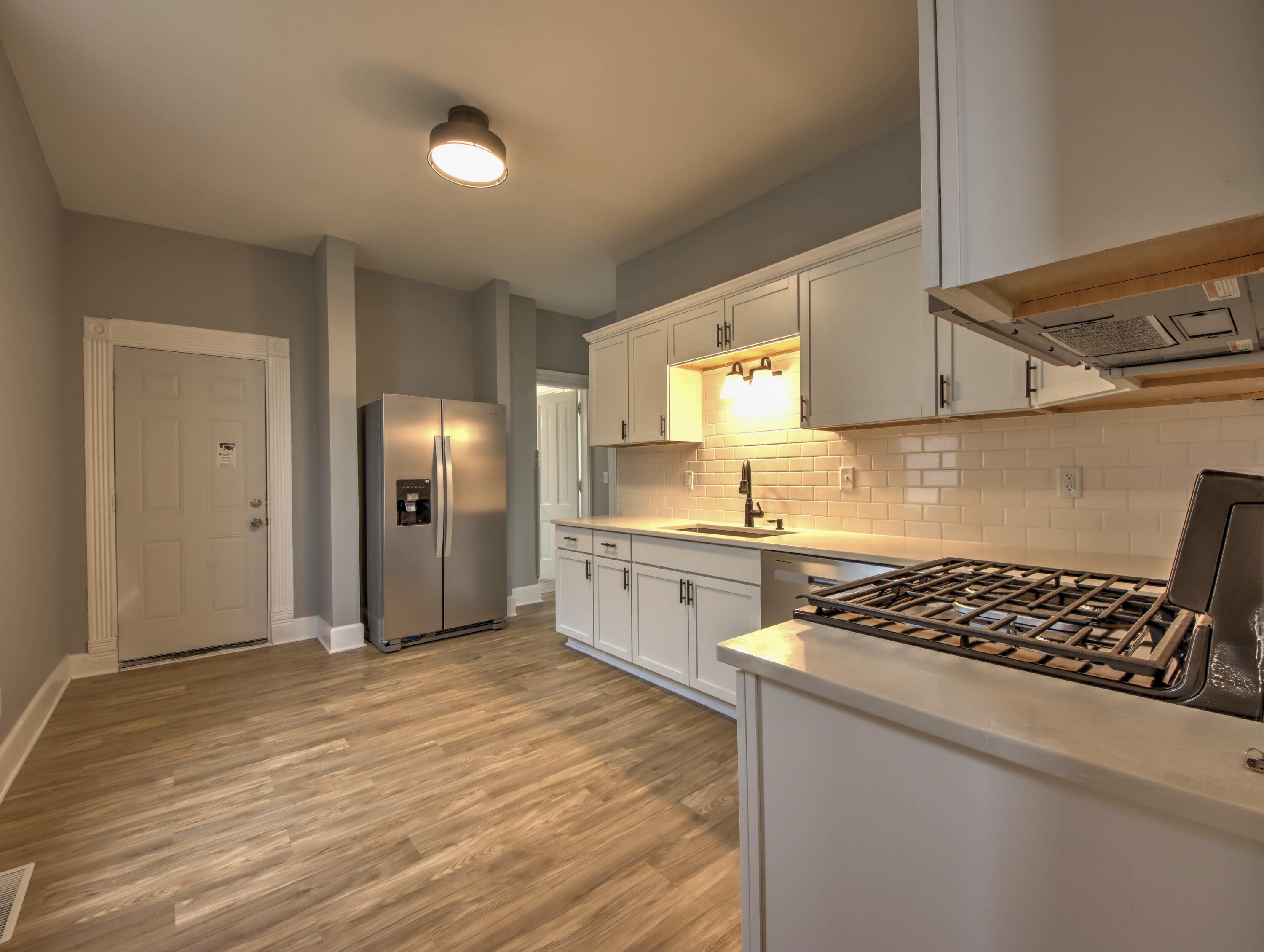 1005 Harrison Street La Porte, IN 46350 - Photo 15 of 54 a kitchen with stainless steel appliances granite countertop a stove and a refrigerator