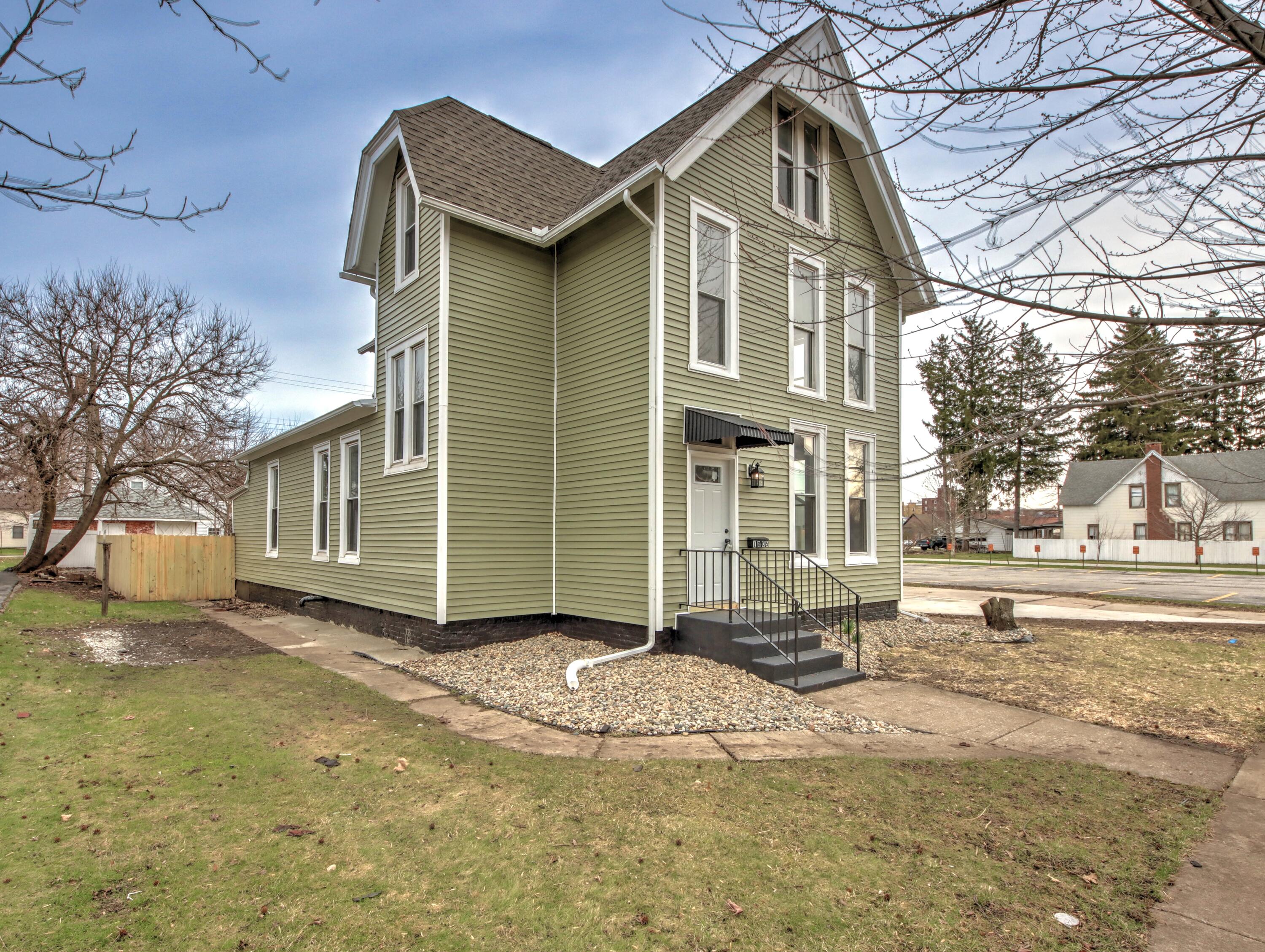 1005 Harrison Street La Porte, IN 46350 - Photo 2 of 54 a front view of a house with a yard