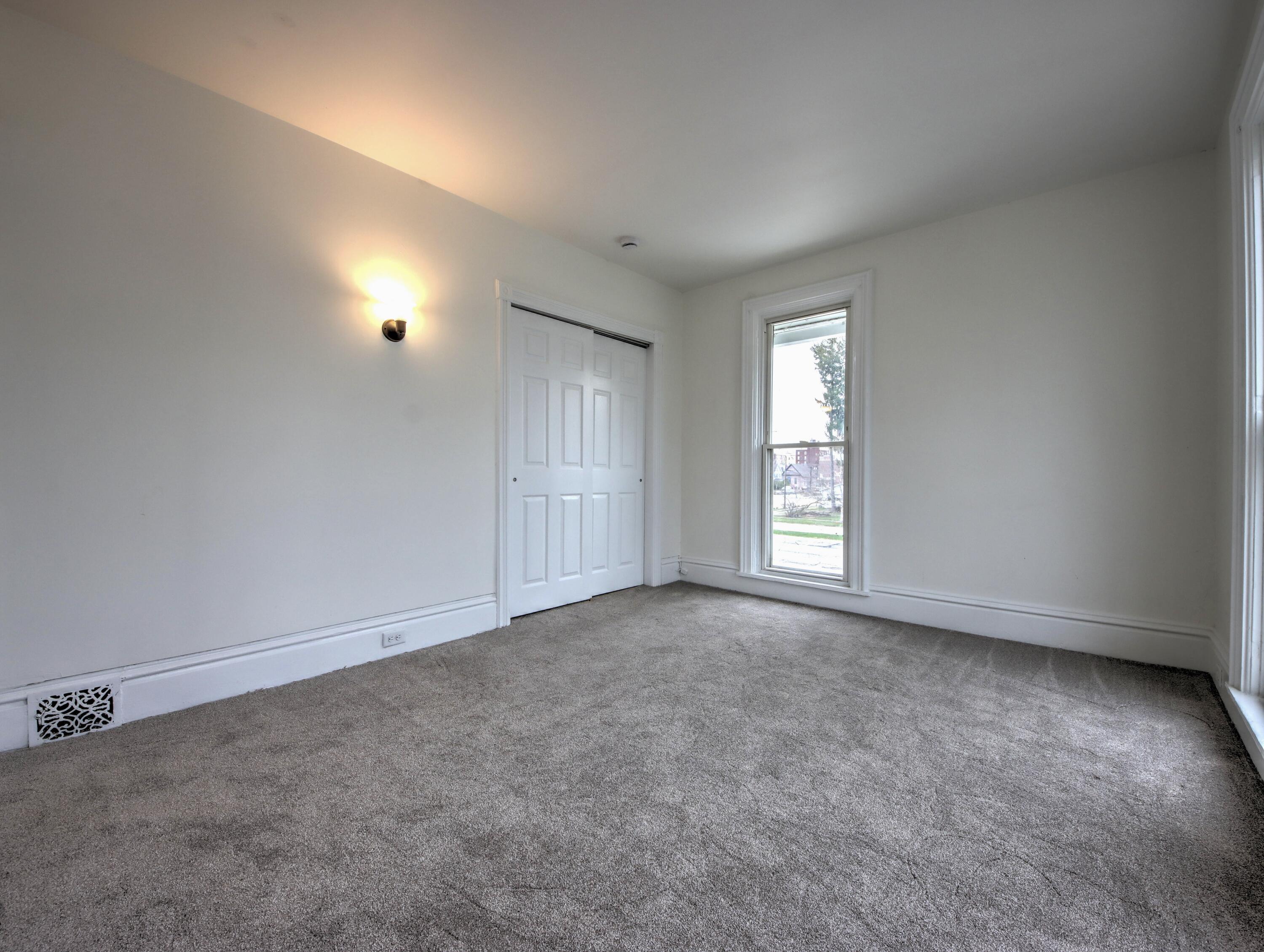 1005 Harrison Street La Porte, IN 46350 - Photo 28 of 54 an empty room with windows