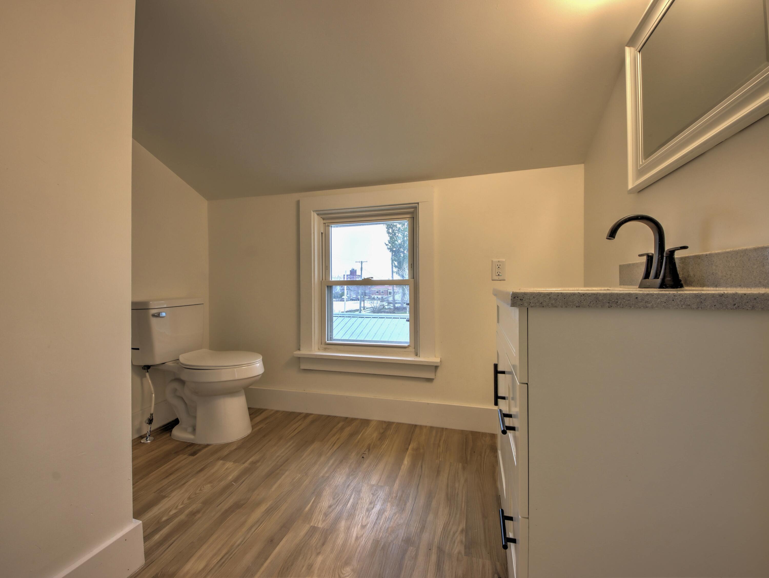 1005 Harrison Street La Porte, IN 46350 - Photo 29 of 54 a bathroom with a sink and a toilet