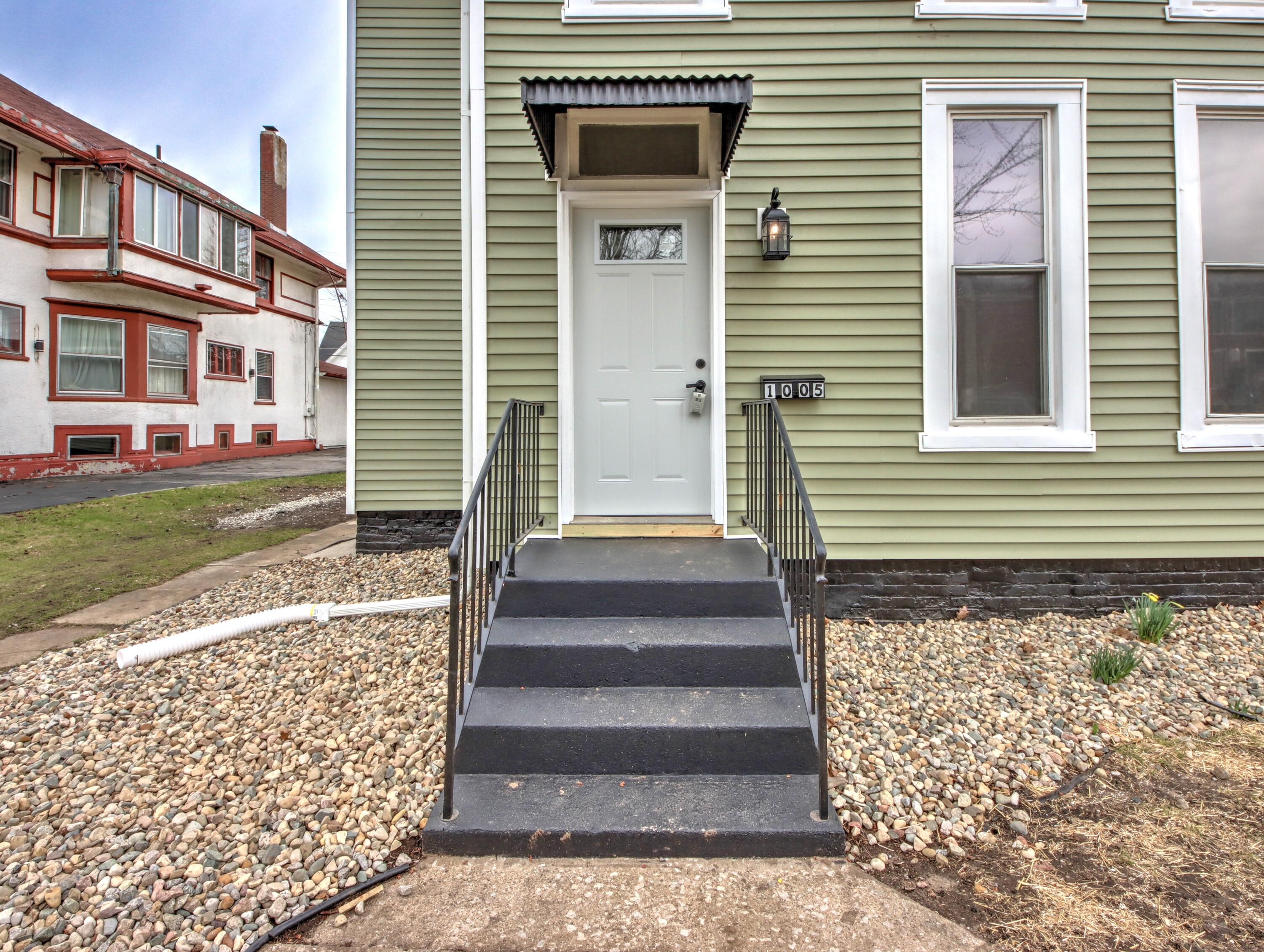 1005 Harrison Street La Porte, IN 46350 - Photo 3 of 54 a front view of a house with a garden
