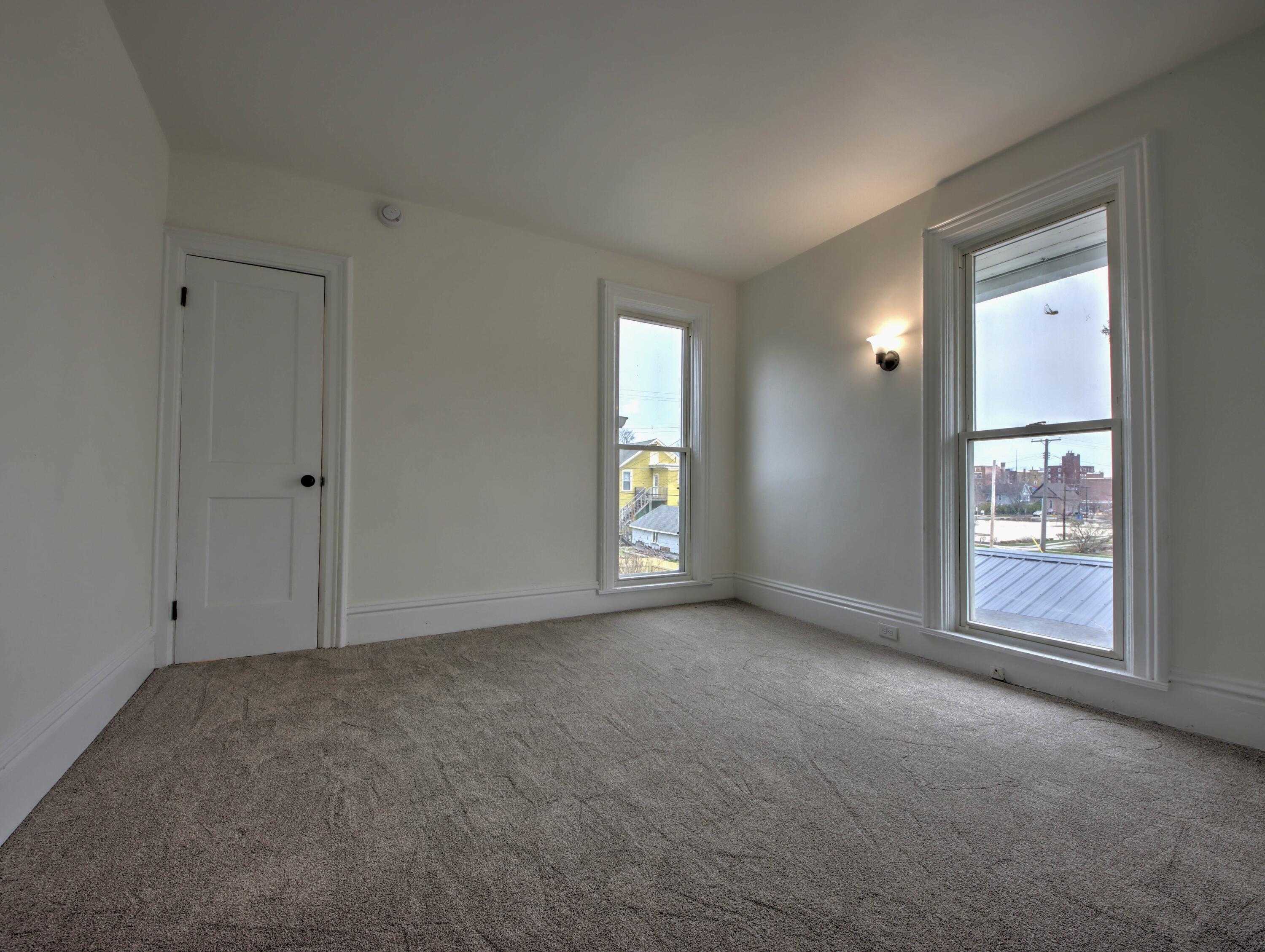 1005 Harrison Street La Porte, IN 46350 - Photo 34 of 54 an empty room with windows and closet