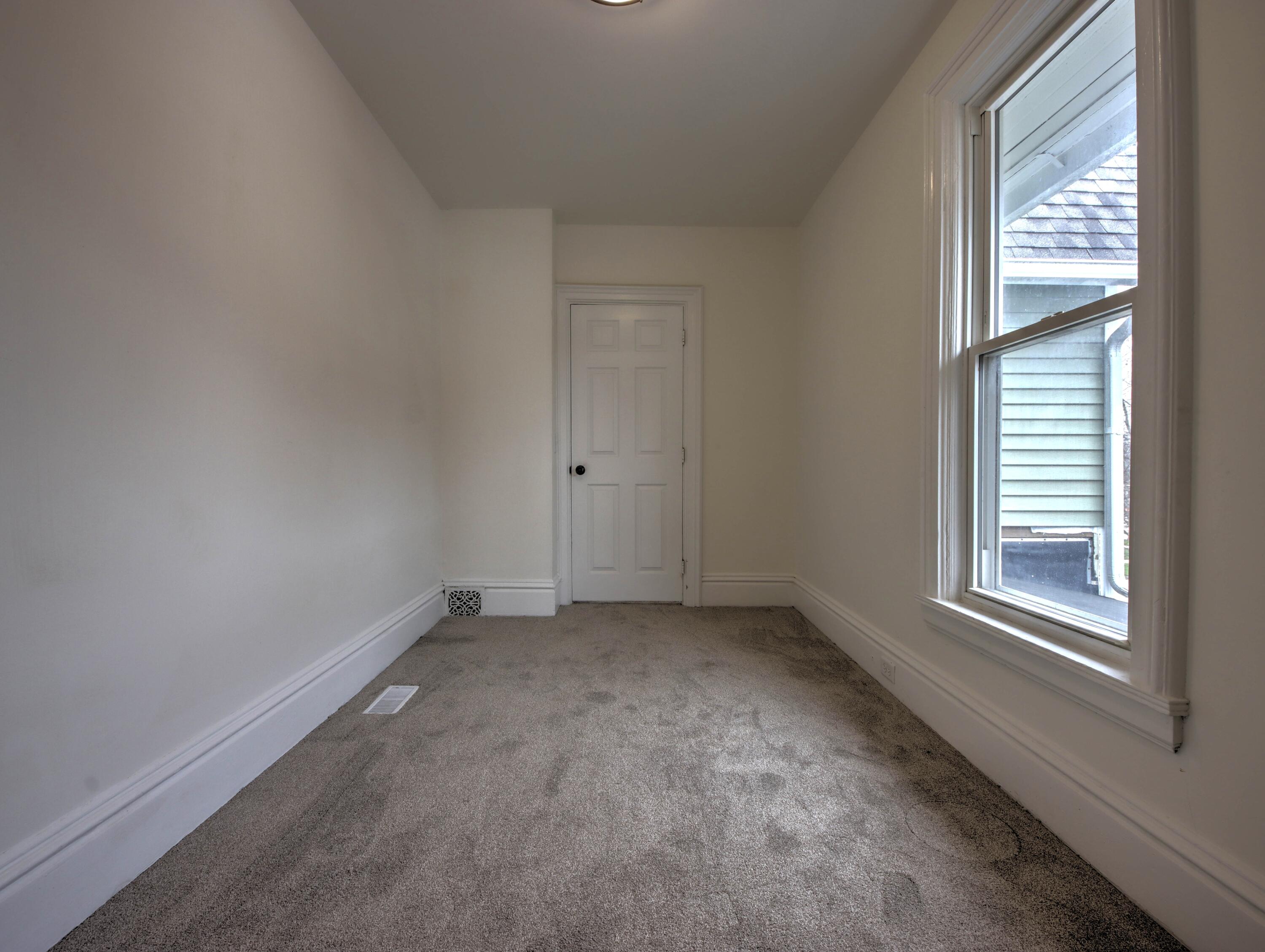 1005 Harrison Street La Porte, IN 46350 - Photo 36 of 54 an empty room with windows