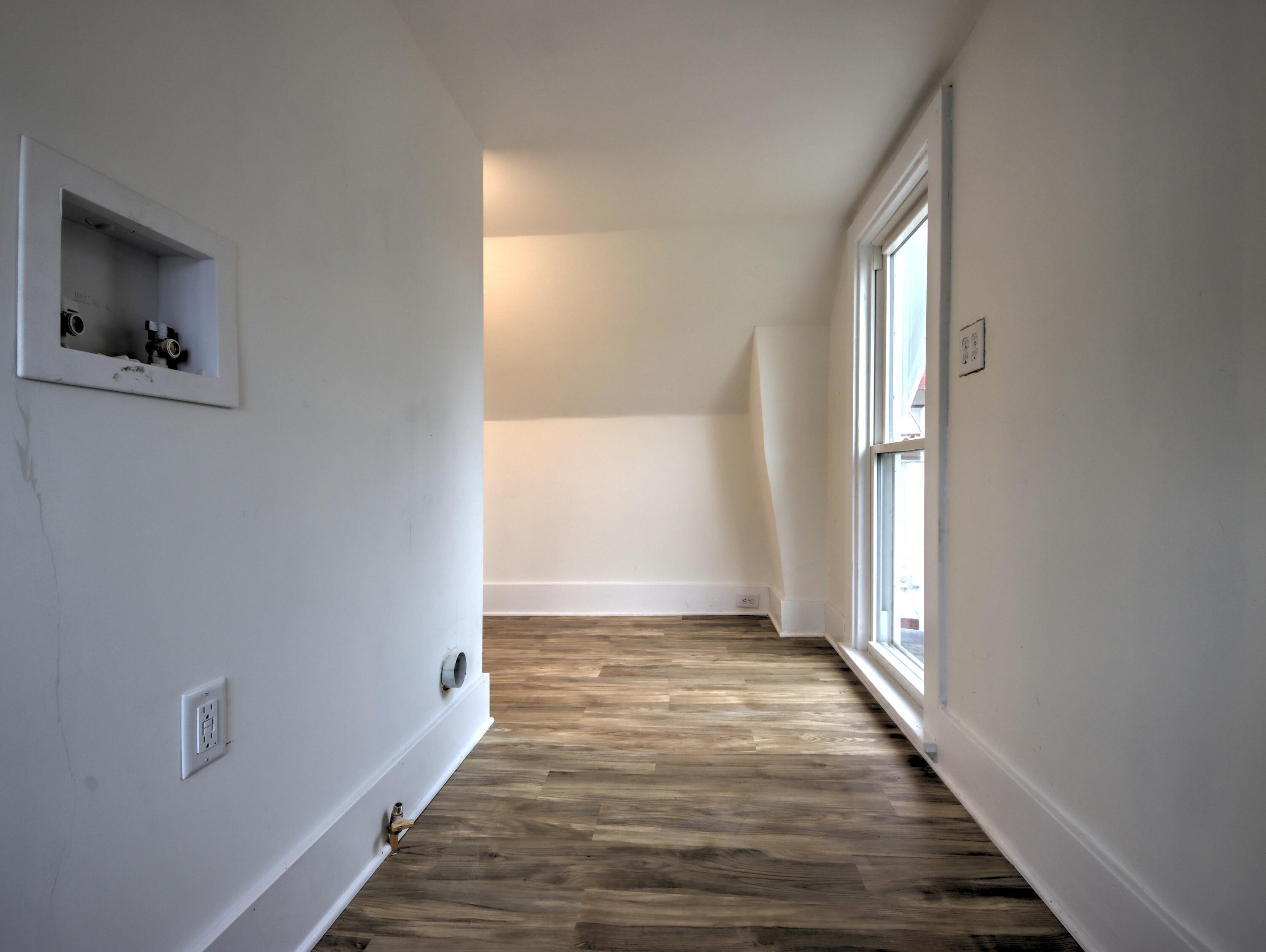 1005 Harrison Street La Porte, IN 46350 - Photo 40 of 54 a view of a room with wooden floor and window