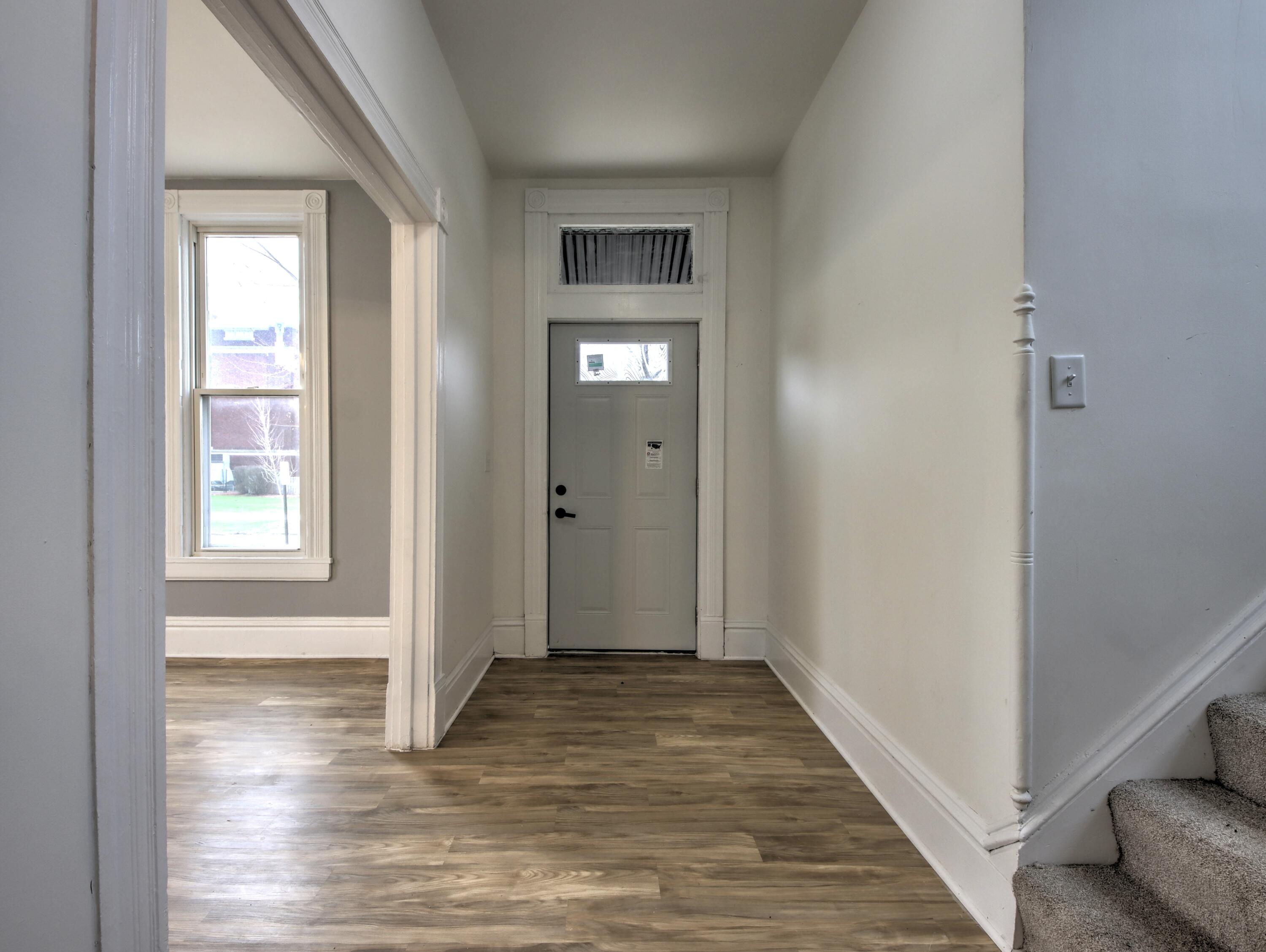 1005 Harrison Street La Porte, IN 46350 - Photo 4 of 54 a view of a hallway with wooden floor and closet area