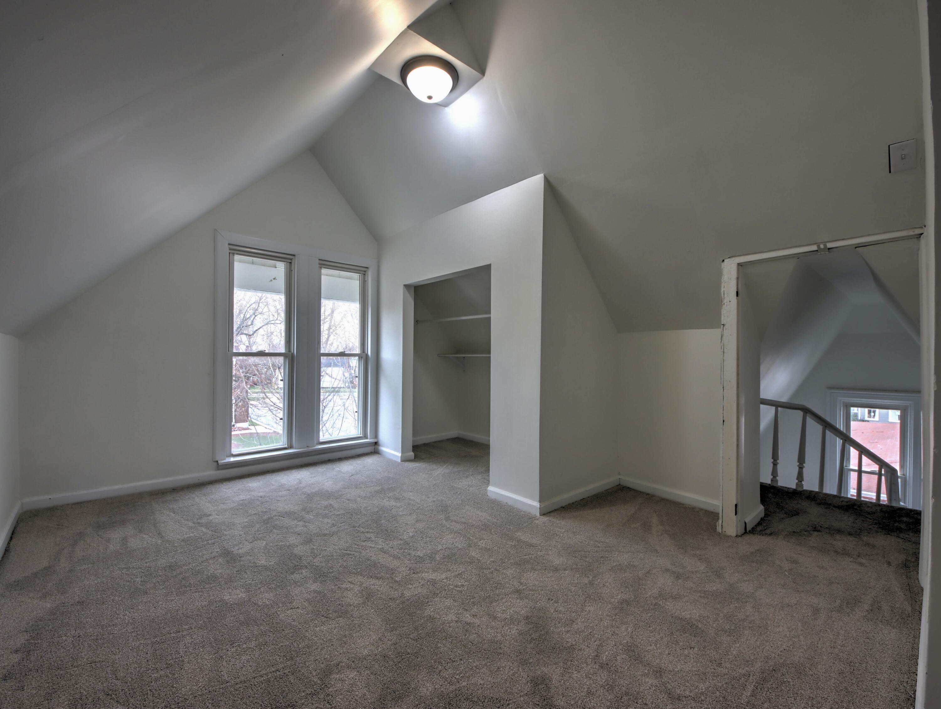 1005 Harrison Street La Porte, IN 46350 - Photo 43 of 54 an empty room with windows and ceiling fan